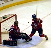 Jamie Lundmark sends a puck across the crease
