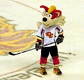 Firestorm plays with a puck during the 2nd intermission