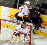 Brett Palin handles Chris Durno behind the Flames net